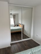 Mirror sliding wardrobe doors with polished silver frames