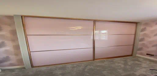 Coloured glass fitted wardrobes.