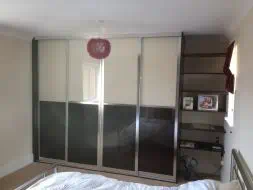 Split design with black and cream glass in a polished silver frame