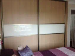 Montana wood panel sliding door with a white divider strip in light bronze frames, fitted in Stockton-on-Tees