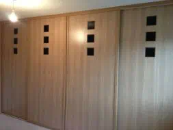 Oak sliding door with hand routed black squares