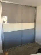 Light brown with a cream dividing strip in brushed silver frames, fitted in Kirklevington
