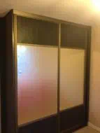 Hacendia black wood with a large mirror strip in light bronze