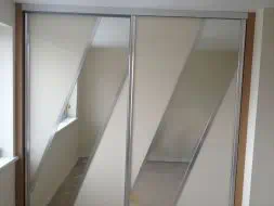 Diagonal split sliding doors in posihed silver frames