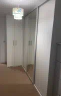 Small hinged wardrobe to help maximise the avaliable space