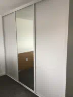 Cashmere 3 door sliding wardrobe with 2 plain panels and a centeral mirror door, fitted in Darlington