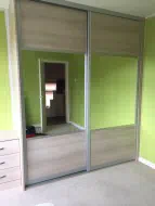 Split panel door with horizonal woodgrain panels and mirror, installed in Fairfield