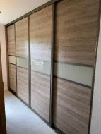 Horizontal grained wood with a soft white glass dividing strip, fitted in Saltburn