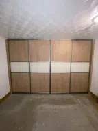 Oak panels with a white panel divide in brushed champagne frames, fitted in Bowburn