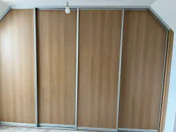 4 Plain wooden doors with sloped ceilings
